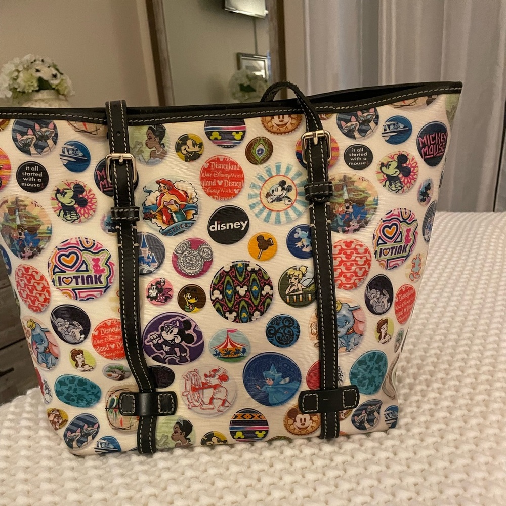 DISNEY DOONEY & BOURKE BUTTONS TOTE - IN BLACK WITH DISNEY THEME.